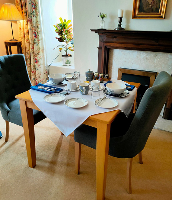 A table set up for breakfast in the breakfast room