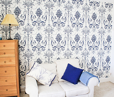 A sofa and chest of drawers in room one